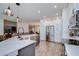 Open kitchen with stainless steel appliances, island, and modern finishes at 445 Arch Ridge Loop, Seffner, FL 33584