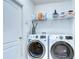 Laundry room equipped with modern washer and dryer at 445 Arch Ridge Loop, Seffner, FL 33584