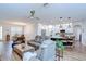 Open-concept living space with a view of the kitchen and dining area at 445 Arch Ridge Loop, Seffner, FL 33584