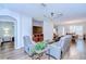 Cozy living room with hardwood floors, ceiling fan, and comfortable seating at 445 Arch Ridge Loop, Seffner, FL 33584