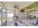 Screened-in patio with ceiling fans and outdoor kitchen at 445 Arch Ridge Loop, Seffner, FL 33584