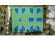 Aerial view of a colorful, well-maintained basketball and volleyball court in a lush community setting at 4652 San Martino Dr, Wesley Chapel, FL 33543