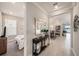 Open hallway with an entryway table, decor and mirror, leading to the bedroom and kitchen at 4652 San Martino Dr, Wesley Chapel, FL 33543