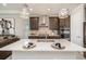 Kitchen island features a quartz countertop, stainless steel sink, and a stylish gooseneck faucet at 4652 San Martino Dr, Wesley Chapel, FL 33543