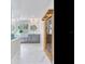 Contemporary bathroom with double vanity, round mirrors, a modern sauna, and marble floors at 4702 W Heron Ln, Tampa, FL 33629