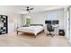Bright bedroom features wood floors, ceiling fan, desk and chair, plus a bookcase and music instruments at 4702 W Heron Ln, Tampa, FL 33629