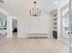Elegant dining room with modern chandelier and ample natural light at 4702 W Heron Ln, Tampa, FL 33629