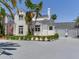Beautiful home with three-car garage, accented with vibrant landscaping and stately design at 4702 W Heron Ln, Tampa, FL 33629