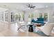 Spacious living room with large windows, a fireplace, and modern decor at 4702 W Heron Ln, Tampa, FL 33629