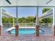 Covered outdoor pool area offering resort-style living at 4702 W Heron Ln, Tampa, FL 33629