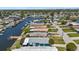 Aerial view of neighborhood waterfront homes, highlighting the canal access and community layout at 5051 Bonito Dr, New Port Richey, FL 34652
