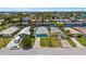 Aerial view of waterfront homes, showcasing the neighborhood's canal access and tropical landscaping at 5051 Bonito Dr, New Port Richey, FL 34652