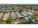 Aerial view showcasing waterfront homes, pool, and the canal community at 5051 Bonito Dr, New Port Richey, FL 34652