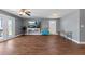 Open-concept living area with stylish flooring and a seamless transition to the outdoor patio at 5051 Bonito Dr, New Port Richey, FL 34652