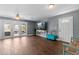 Open-concept living area with stylish decor, wood floors, and a seamless flow to the outdoor space at 5051 Bonito Dr, New Port Richey, FL 34652