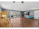 Spacious living room with hardwood floors and doors opening to an outdoor patio at 5051 Bonito Dr, New Port Richey, FL 34652