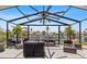 The well-furnished outdoor patio provides comfortable seating and a view of the waterfront at 5051 Bonito Dr, New Port Richey, FL 34652
