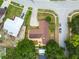 Aerial view of a home highlighting the landscaping, roof, backyard patio, and surrounding neighborhood at 509 Stone Dr, Brandon, FL 33510