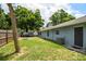 Fenced backyard with mature trees, fire pit and ample space for outdoor activities at 509 Stone Dr, Brandon, FL 33510