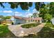 Expansive backyard with lush lawn, patio, and mature trees, perfect for outdoor entertaining at 509 Stone Dr, Brandon, FL 33510