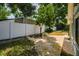 Landscaped backyard with privacy fence, storage shed, and mature trees providing ample shade at 509 Stone Dr, Brandon, FL 33510