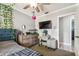 Comfortable bedroom features decorative lighting, flat screen tv, large dresser, and an ensuite bathroom at 509 Stone Dr, Brandon, FL 33510