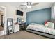 Bright bedroom with ceiling fan, a mounted TV, vanity, and an adjoining room at 509 Stone Dr, Brandon, FL 33510