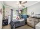 A cozy bedroom with vines, decorative lights, stuffed animals and a large window with natural light at 509 Stone Dr, Brandon, FL 33510