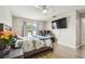 Well-lit bedroom with light wood floors features a ceiling fan and an adjacent work space at 509 Stone Dr, Brandon, FL 33510