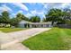 Inviting curb appeal with a well-maintained lawn, mature trees, and a long driveway at 509 Stone Dr, Brandon, FL 33510