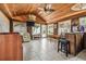 Spacious living room with wood ceilings, tile floor, bar area, and natural light from multiple windows at 509 Stone Dr, Brandon, FL 33510