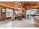 Unique entertainment room featuring wood paneling, bar, and access to outside and the living room at 509 Stone Dr, Brandon, FL 33510