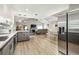 Bright open living space with modern kitchen, stainless appliances, and a vaulted ceiling at 509 Stone Dr, Brandon, FL 33510