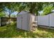 Storage shed in backyard with shelving, perfect for gardening tools and outdoor equipment at 509 Stone Dr, Brandon, FL 33510