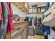 Spacious walk-in closet with wooden shelving, drawers, and plenty of room for storage at 509 Stone Dr, Brandon, FL 33510