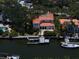 Aerial view of home on the canal featuring a private boat dock and waterfront access at 514 Riviera Dr, Tampa, FL 33606