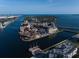 Stunning aerial view of harbor and adjacent waterfront community showcasing coastal living at 514 Riviera Dr, Tampa, FL 33606
