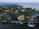 Beautiful waterfront home with lush landscaping and a private dock, offering stunning water views at 514 Riviera Dr, Tampa, FL 33606