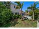 Well-maintained backyard features a pool, lounge area, and lush landscaping, perfect for relaxation at 514 Riviera Dr, Tampa, FL 33606