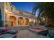 Inviting backyard with a pool and hot tub perfect for outdoor entertaining in a mediterranean-style villa at 514 Riviera Dr, Tampa, FL 33606