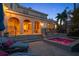 Exterior twilight shot showcases backyard pool, spa, outdoor seating, and waterfront views at 514 Riviera Dr, Tampa, FL 33606