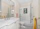 Elegant bathroom featuring a glass shower, marble countertop, modern fixtures, and stylish tile flooring at 514 Riviera Dr, Tampa, FL 33606