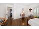 Spacious bedroom features hardwood floors, shutters, and plenty of storage at 514 Riviera Dr, Tampa, FL 33606