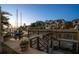 Waterfront home featuring a private boat dock and lift on a calm canal at sunset at 514 Riviera Dr, Tampa, FL 33606