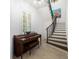 Elegant entryway features a piano, beautiful staircase, and decorative artwork at 514 Riviera Dr, Tampa, FL 33606