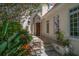 Inviting front entrance with stone steps, detailed archway, and lush landscaping creating curb appeal at 514 Riviera Dr, Tampa, FL 33606