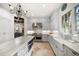 Open-concept kitchen with stone floors, granite countertops, and stainless steel appliances at 514 Riviera Dr, Tampa, FL 33606