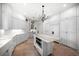 Well-organized kitchen featuring white cabinets, marble counters, stainless steel appliances, and a center island at 514 Riviera Dr, Tampa, FL 33606