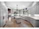 Spacious kitchen featuring custom cabinets, a large center island, and stainless steel appliances at 514 Riviera Dr, Tampa, FL 33606
