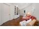 Inviting living room with hardwood floors, custom bookcase and plush seating at 514 Riviera Dr, Tampa, FL 33606